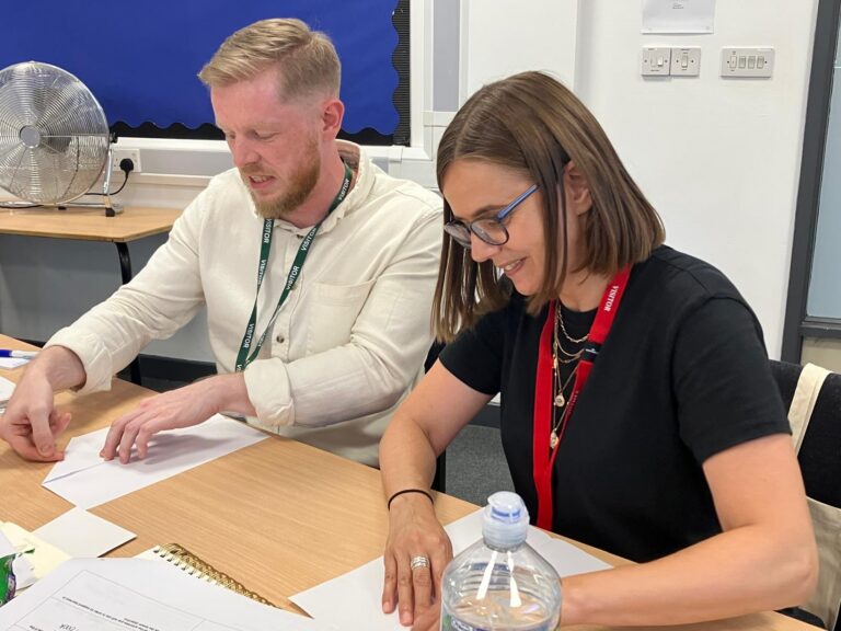 A mentor and trainee working through lesson planning